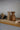 Salt and pepper shakers in oak and teak on a wooden tray